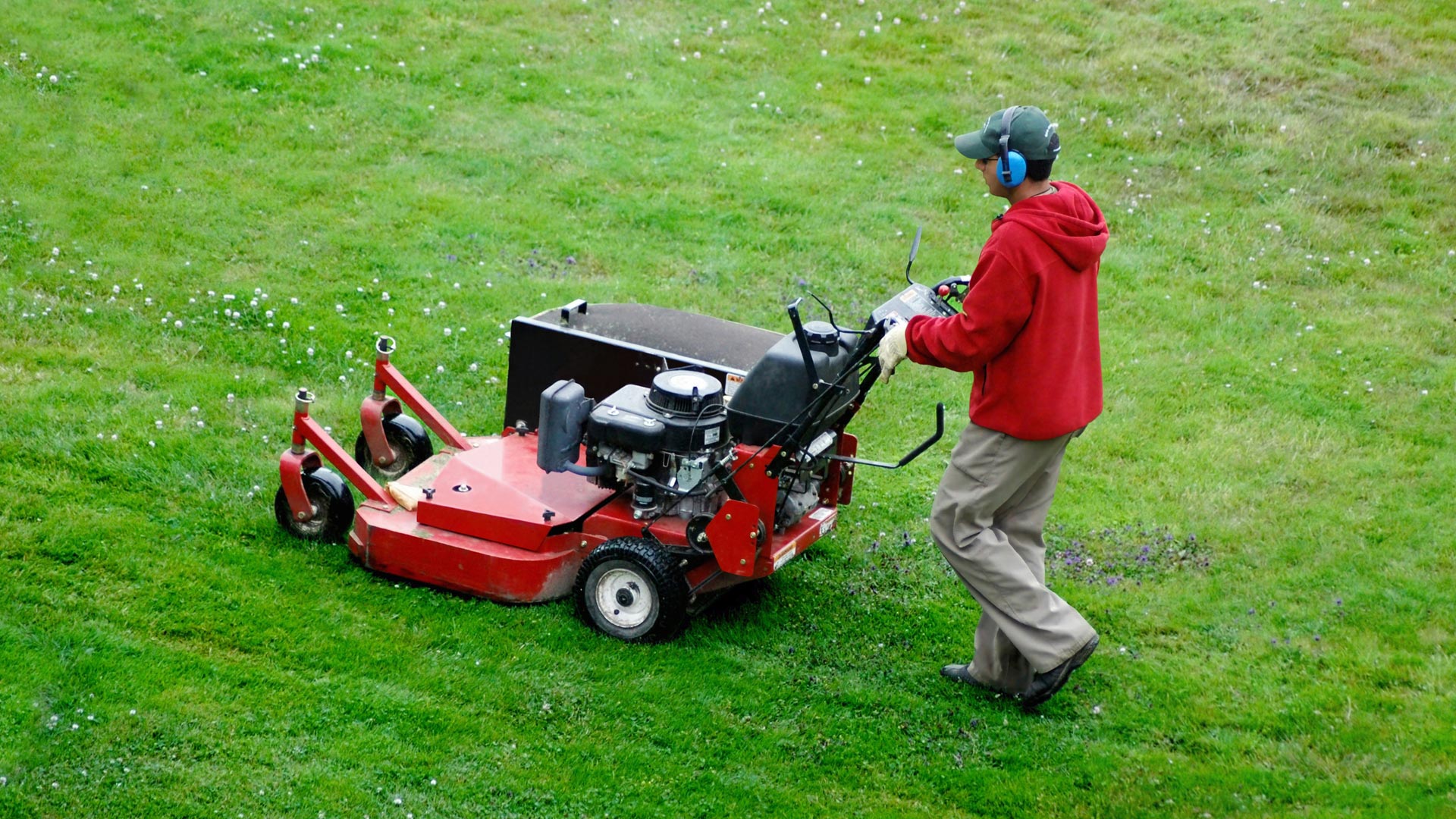 One of our employees mowing a large property, join our team of lawn care technicians.